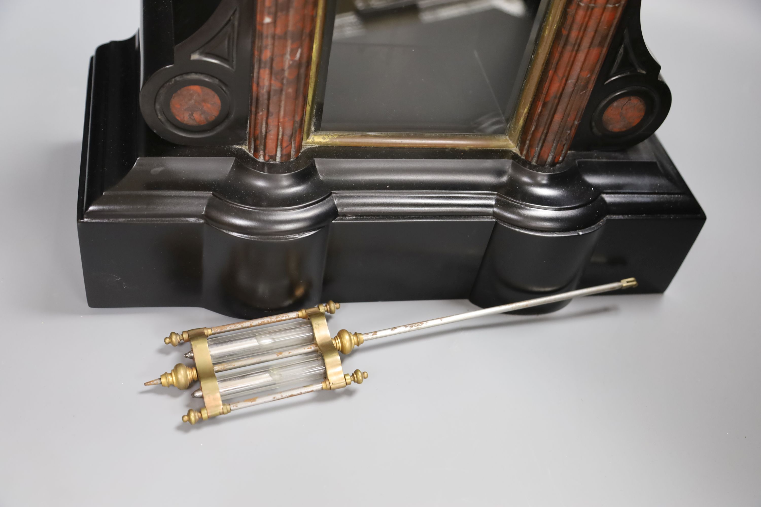 A Victorian black slate and rouge marble mantel clock, height 46cm